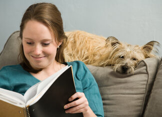 Essential Guide to Pet Nutrition for Healthier Pets Woman reading with dog