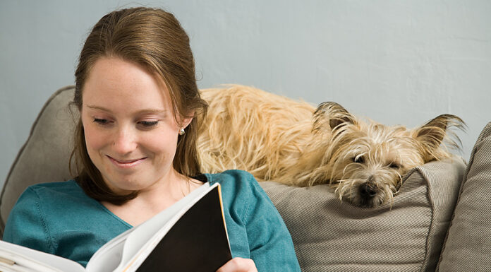 Essential Guide to Pet Nutrition for Healthier Pets Woman reading with dog